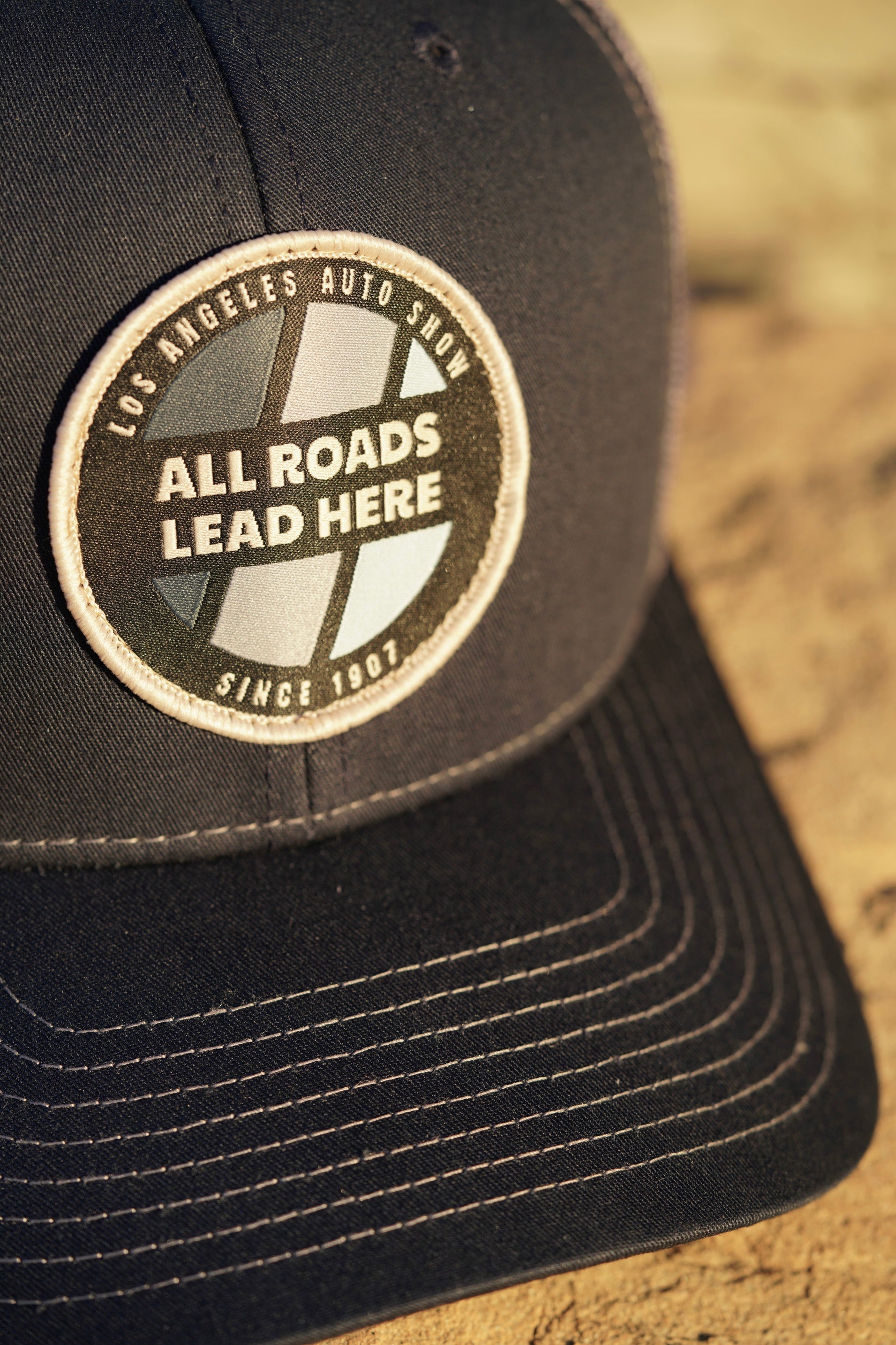 LAAS23 CIRCLE TRUCKER HAT (Navy/Charcoal)